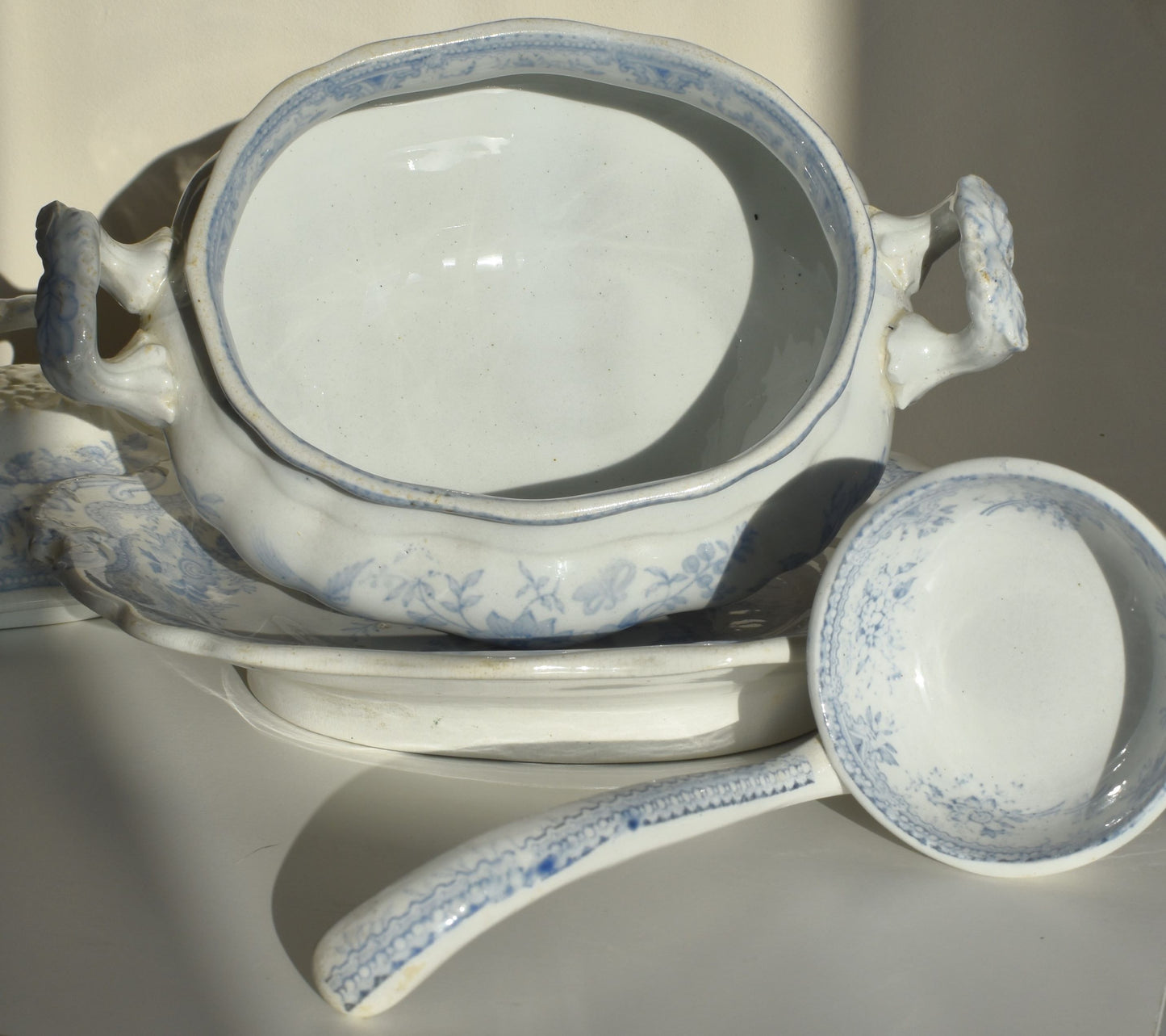 The inside of the tureen and ladle are clean and white