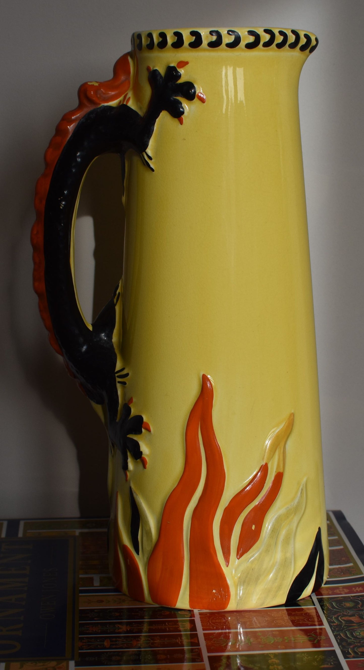The yellow reverse of the jug showing the other side of the black and dragon handle