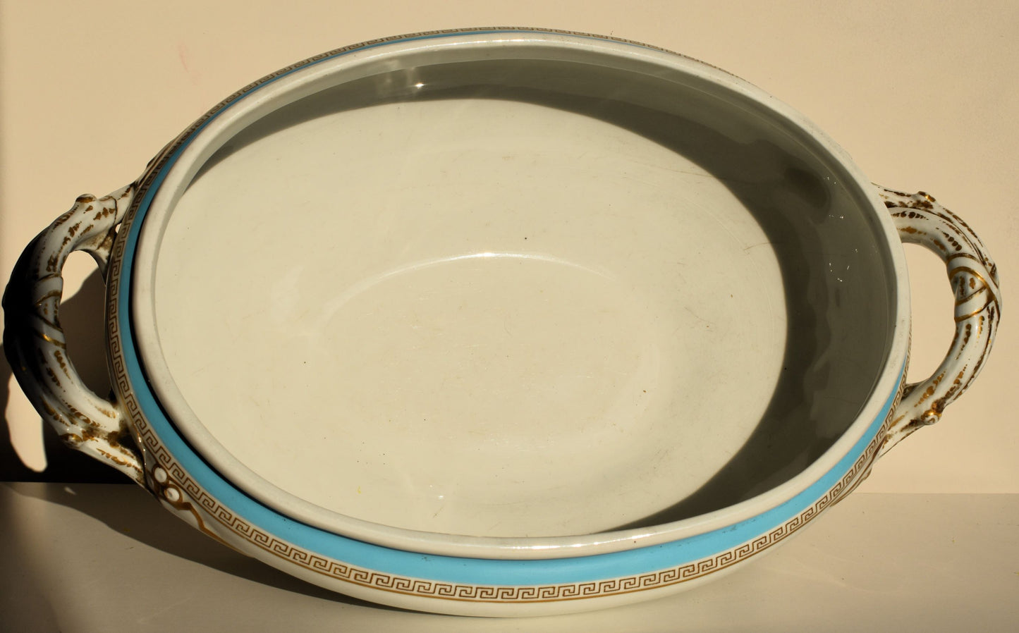 The inside of the tureen bowl is clean and white
