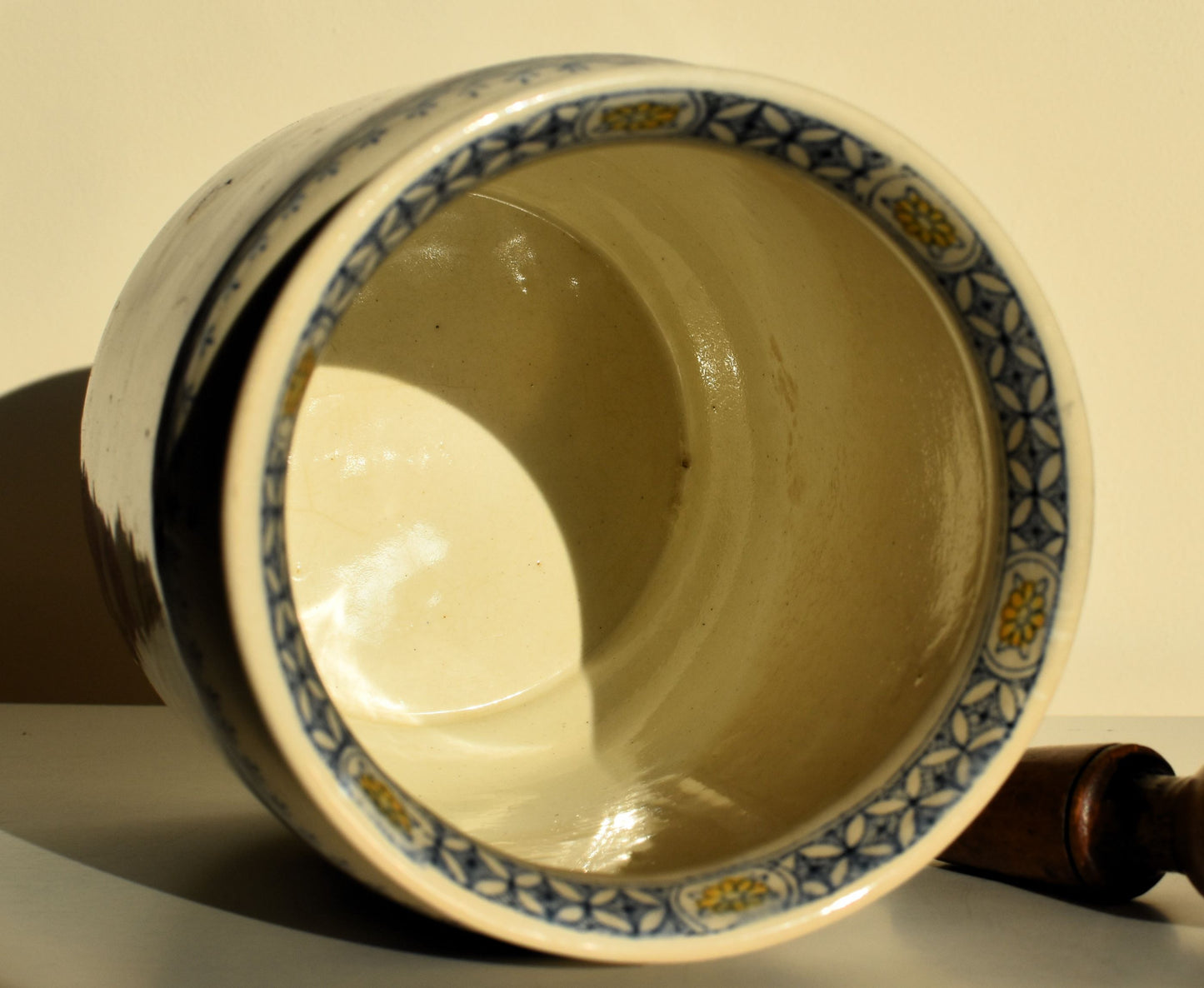 The inside of the pot is clean and cream coloured