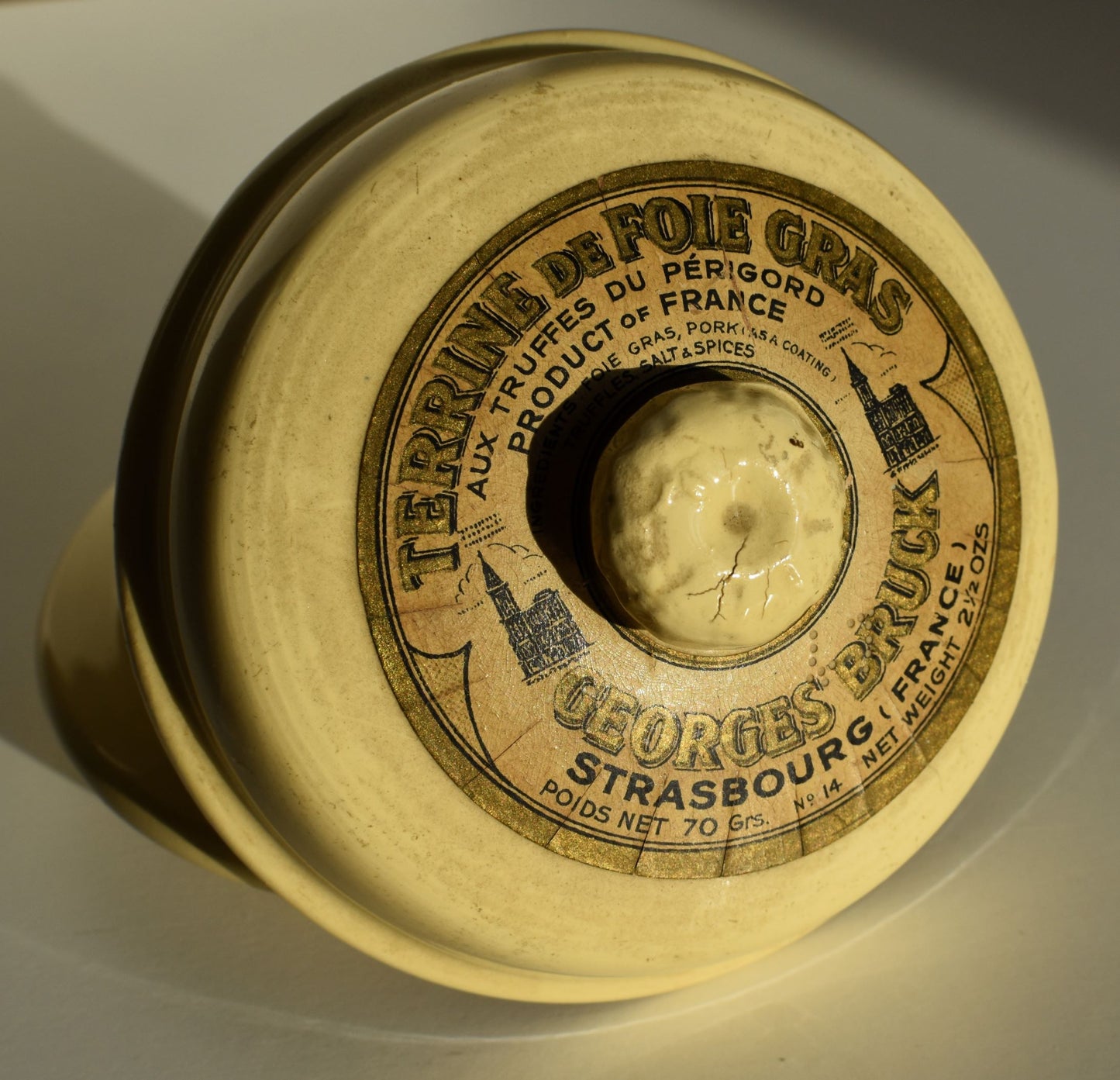 The label on top of the pot reads Terrine de Foie Gras, with truffles of Perigord; foie gras, pork, truffles, salt and spices; supplier Georges Bruck of Strasbourg, France.