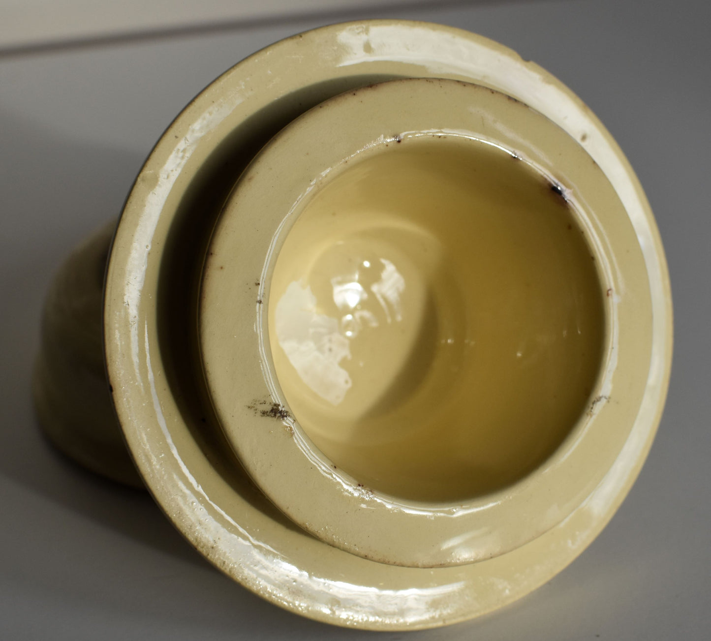 The inside of the pot is clean and cream coloured