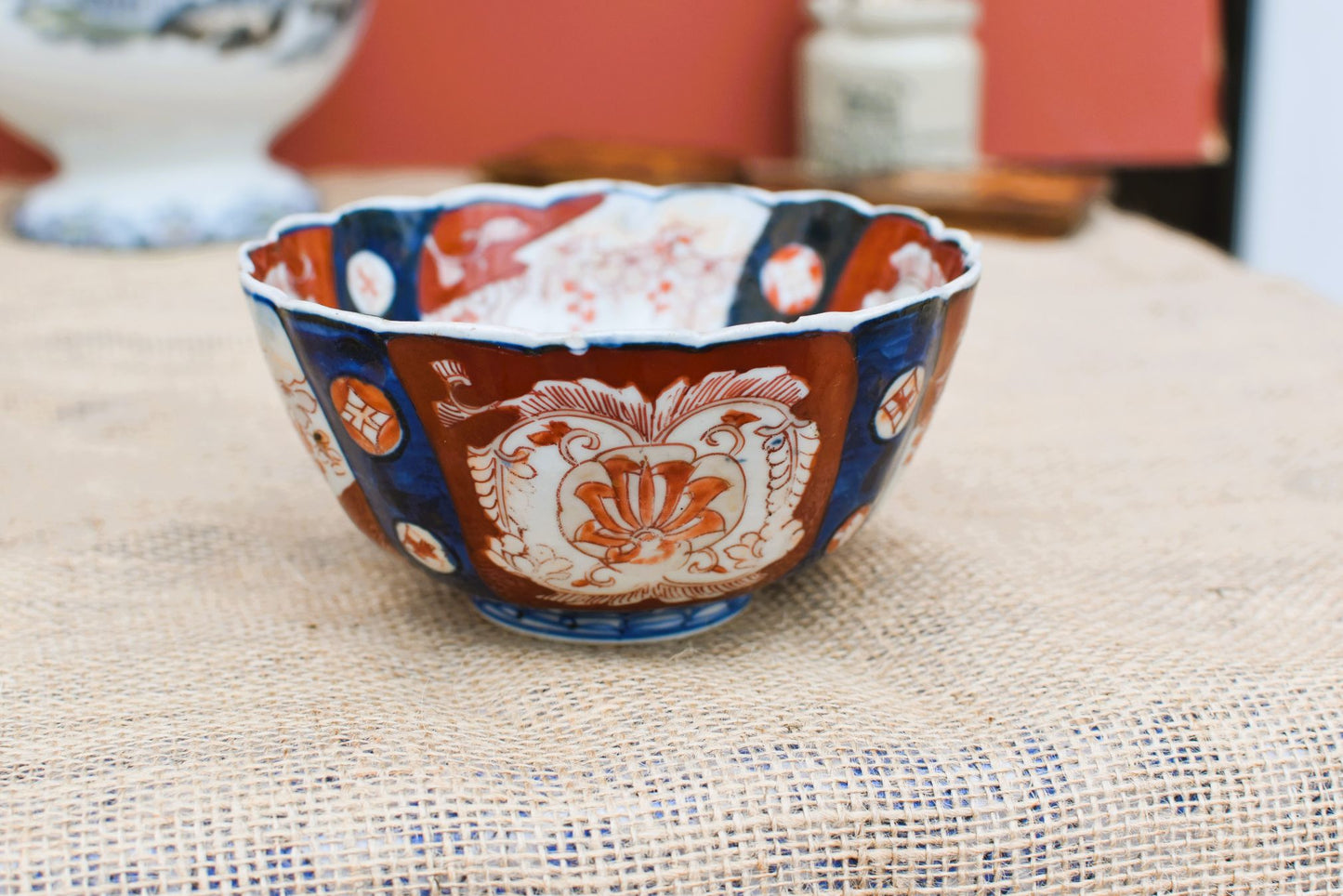 Decorative ceramic bowl with intricate patterns on a textured surface