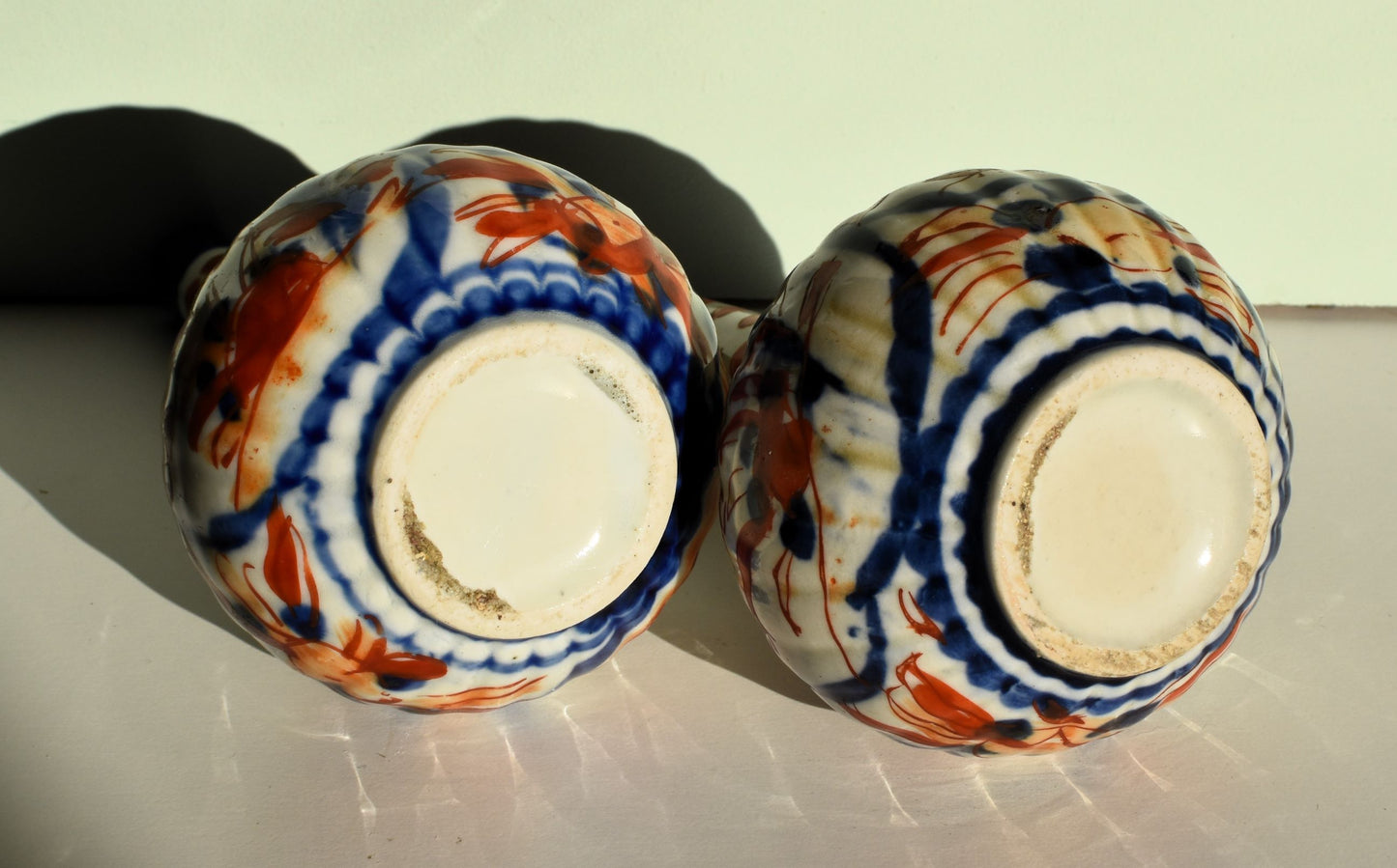 The bases of the vases are plain white with no maker's mark