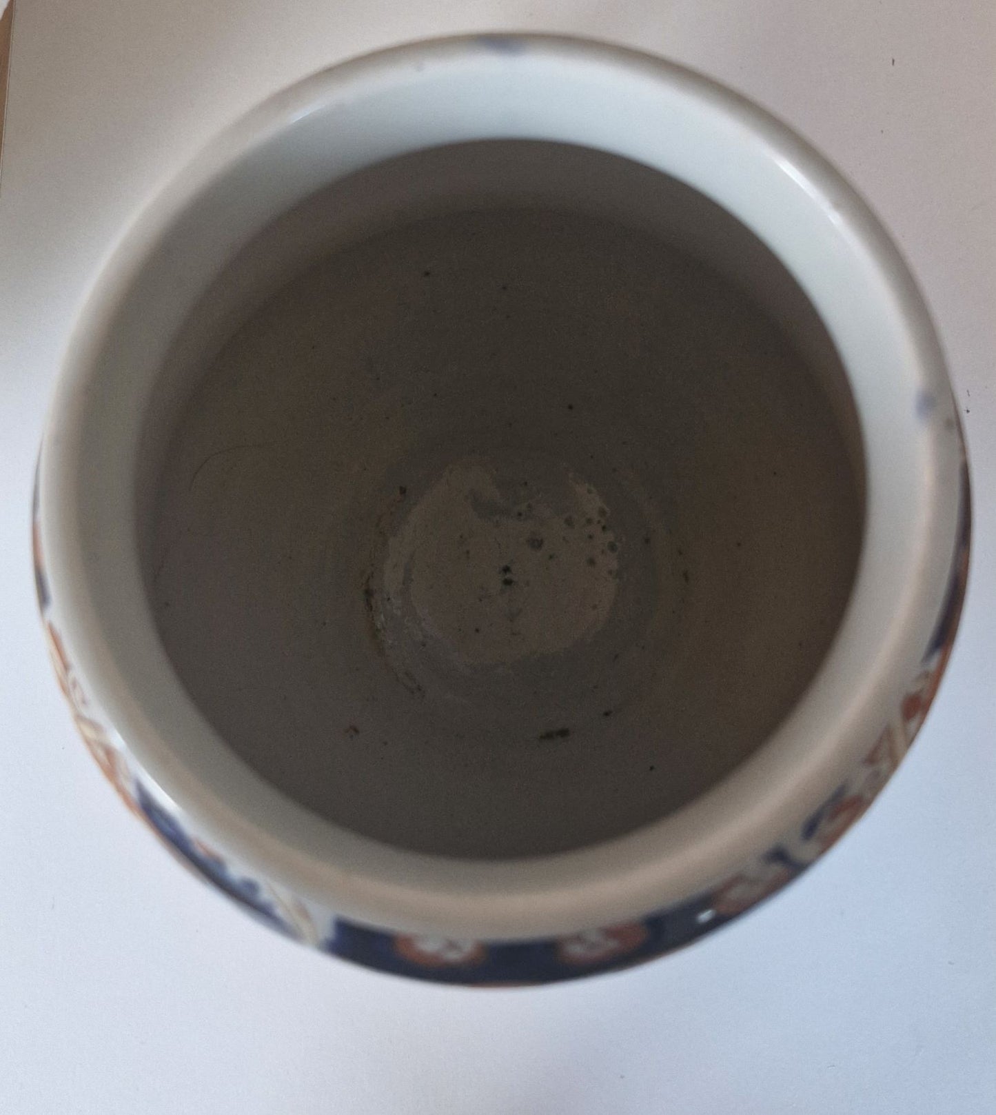 Showing the plain white inside of the vase. No cracks or damage.