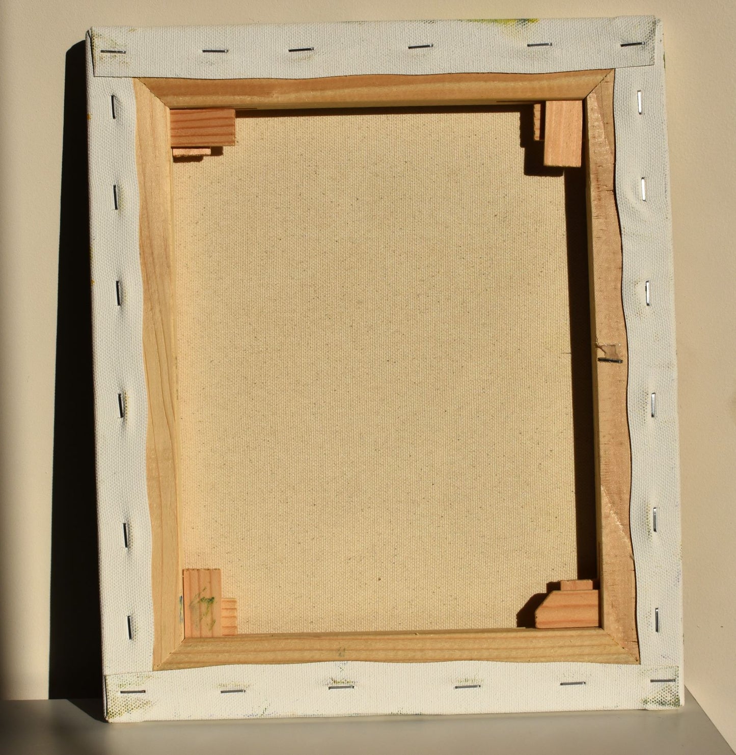 The back of the picture shows the canvas stretched over a wooden frame ready to hang