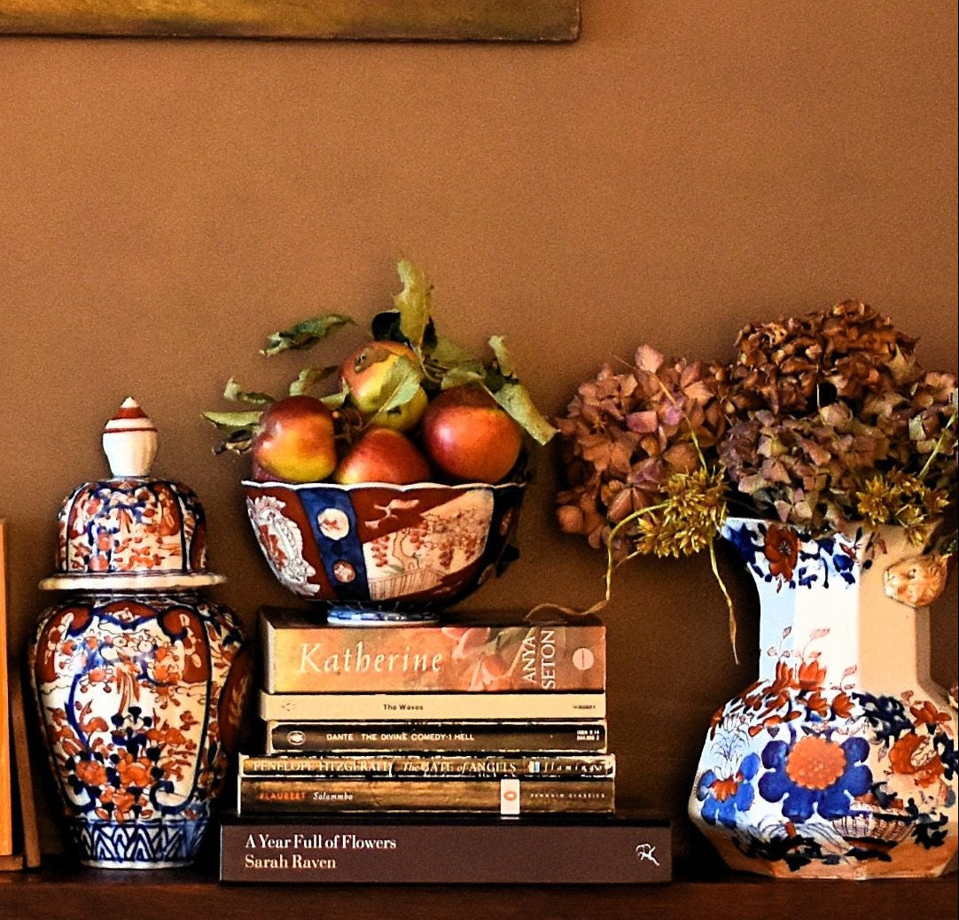 Decorative shelf with books and vases
