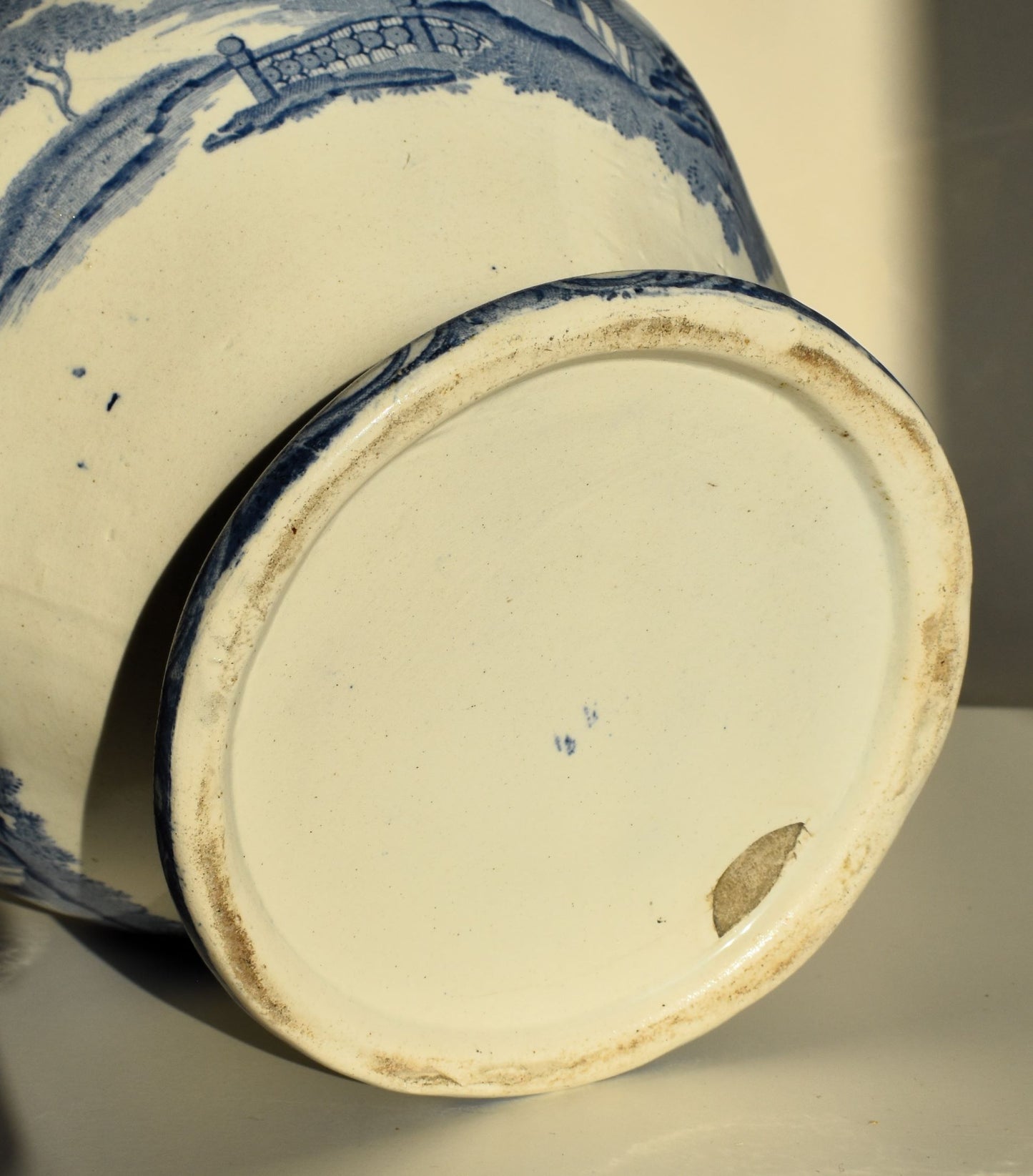 The base shows no maker's mark and the glaze is chipped