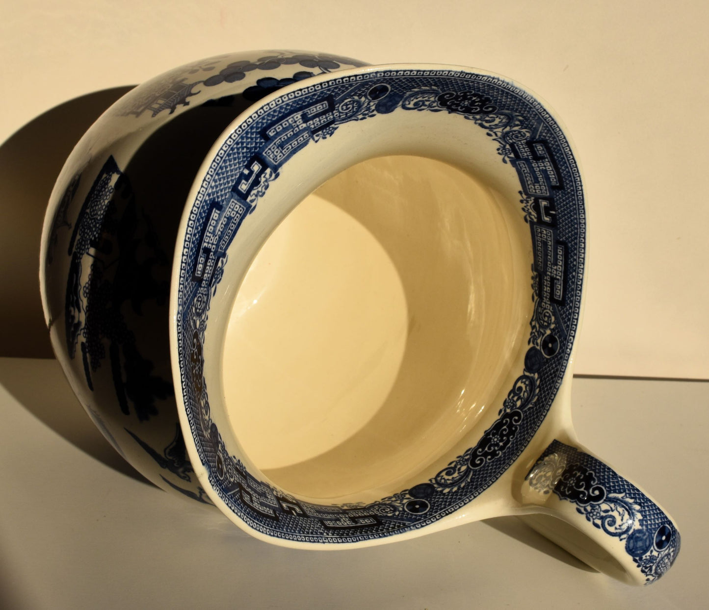 The inside of the large jug is plain white