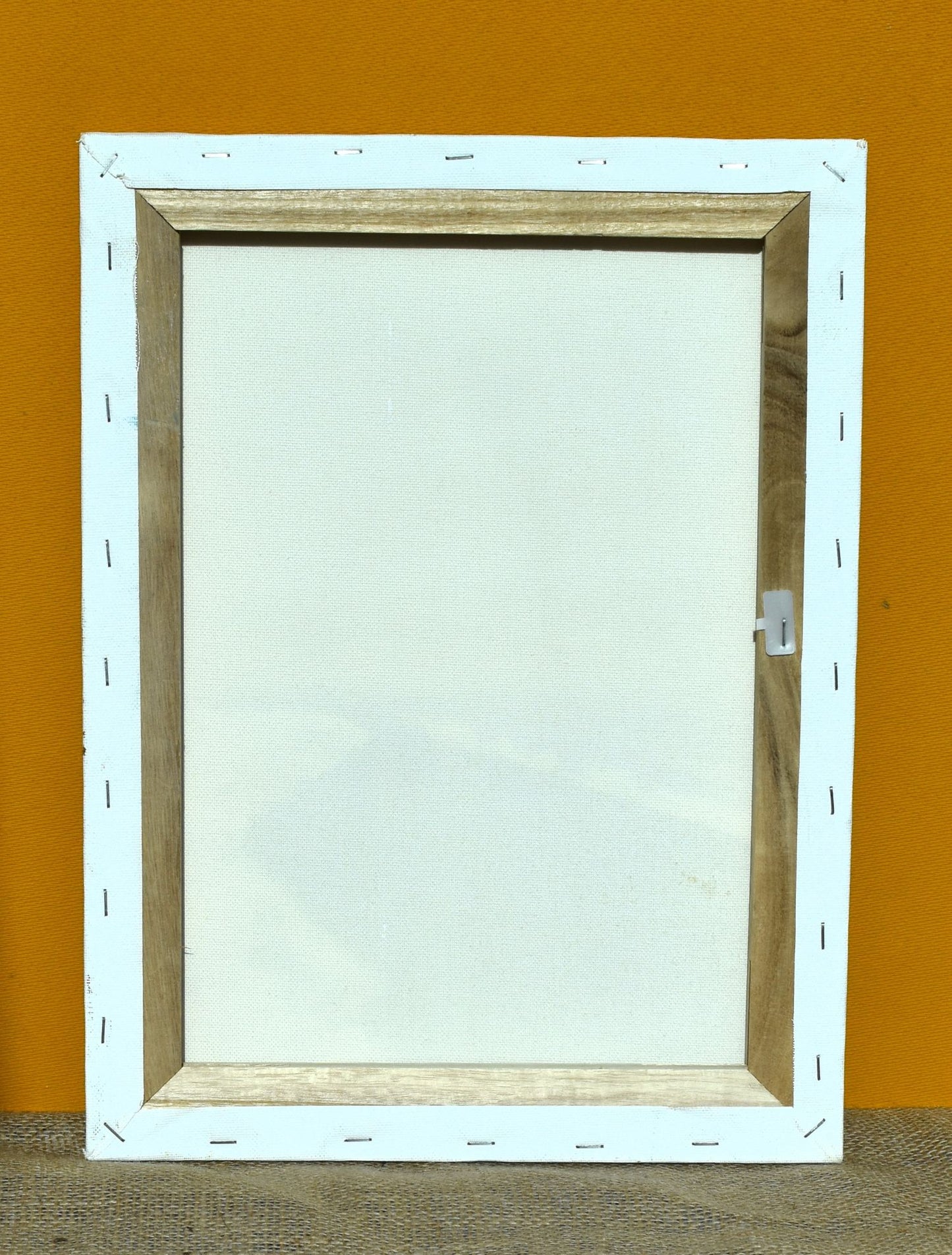 The back of the painting is white canvas