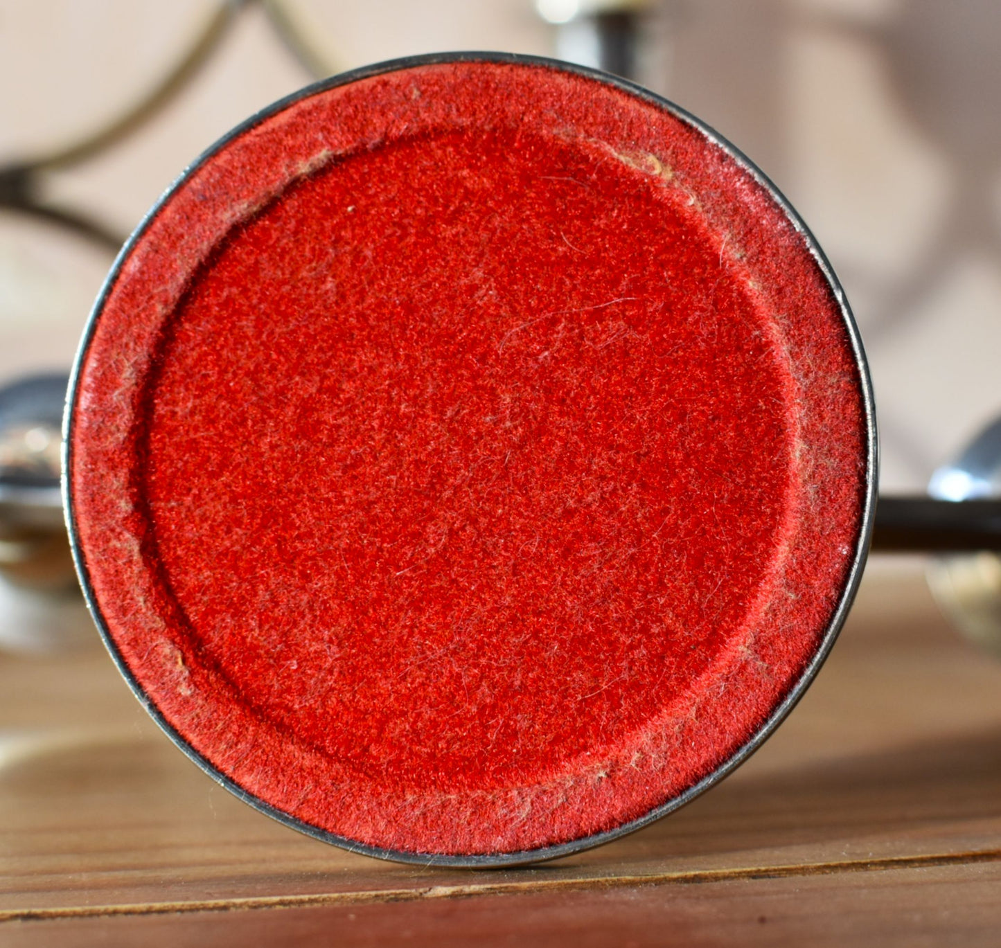 the bottom of the candle holder is made of red felt in a perfect circle