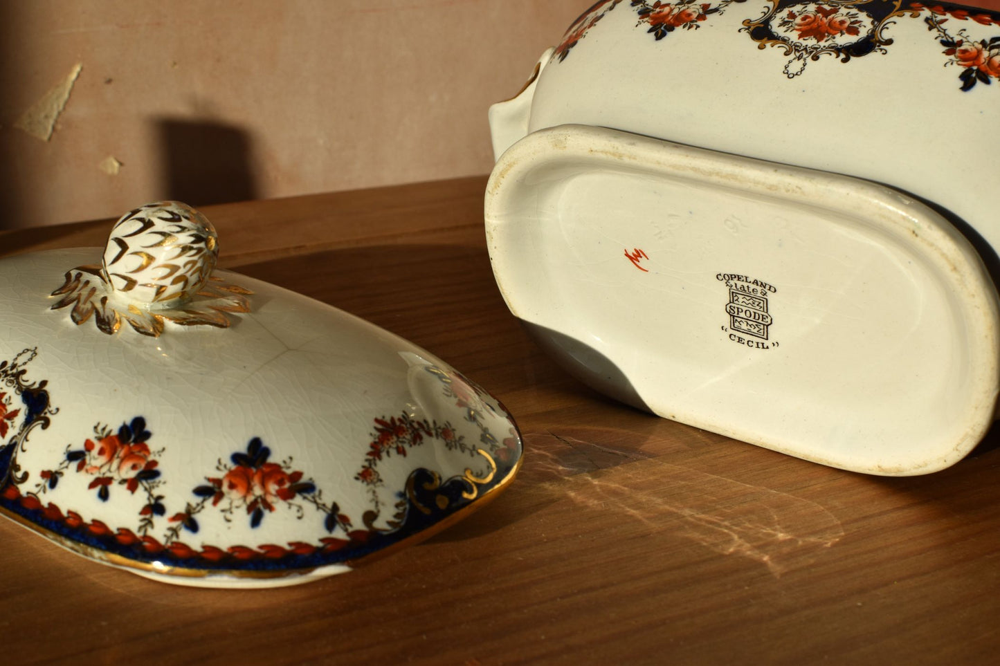 Decorative ceramic dish with floral patterns on a wooden surface