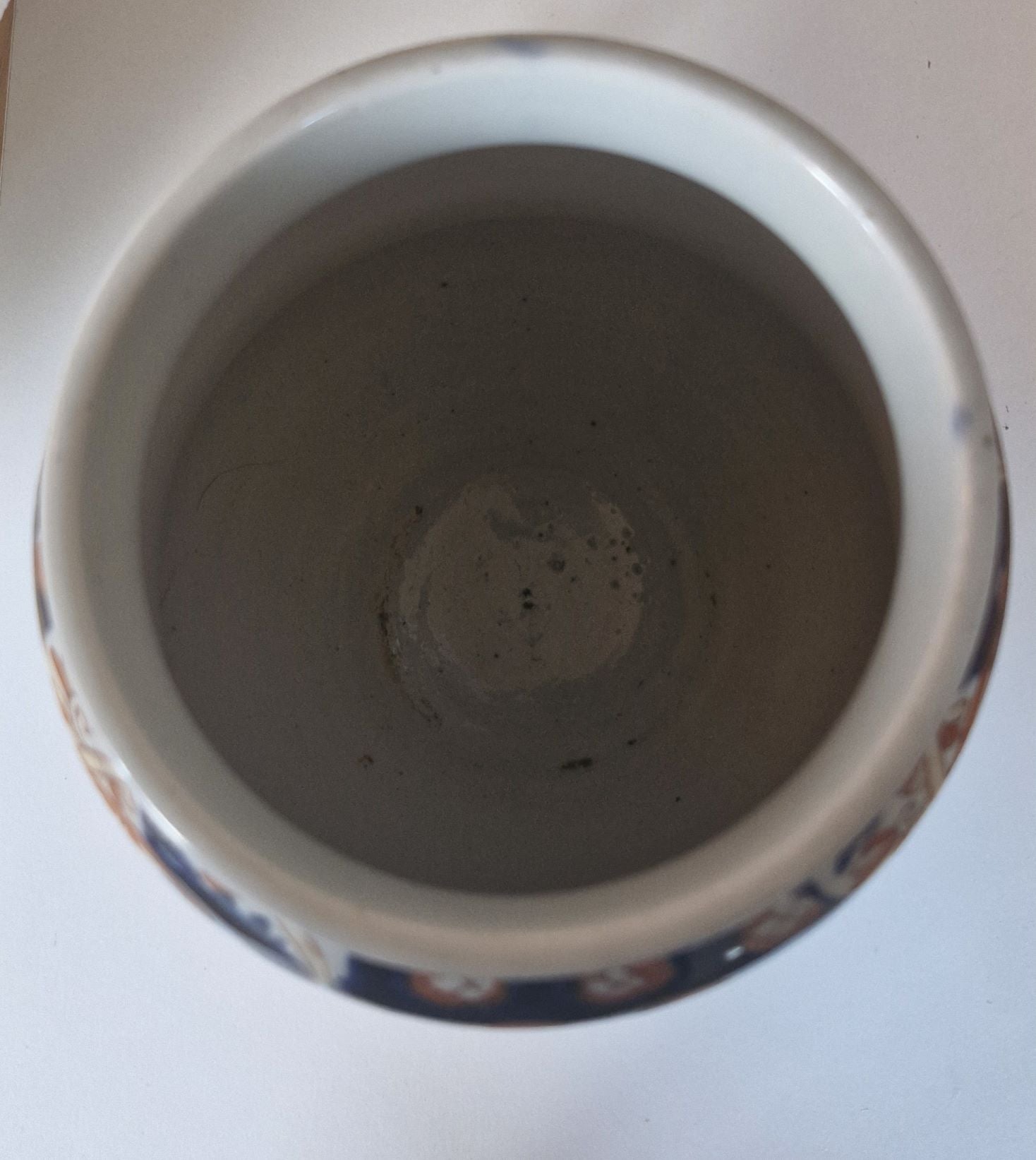 Showing the plain white inside of the vase. No cracks or damage.