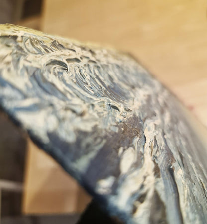 Close-up of a textured surface with wavy patterns