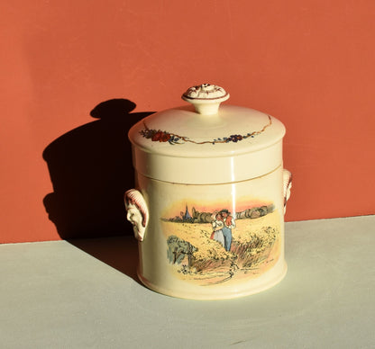 Decorative ceramic jar with a lid on a flat surface against a red background
