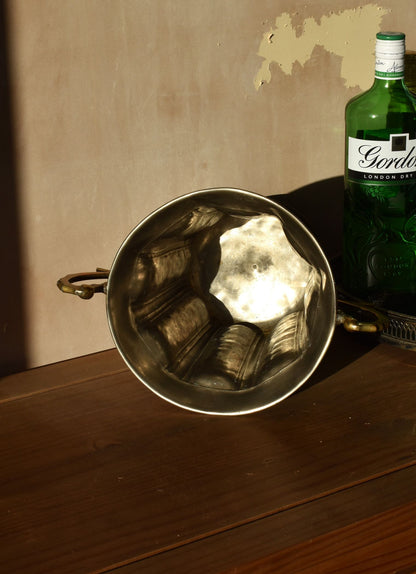 the inside of a silver ice bucket is plain and clean
