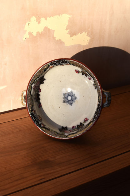 Ceramic bowl with decorative patterns on a wooden surface