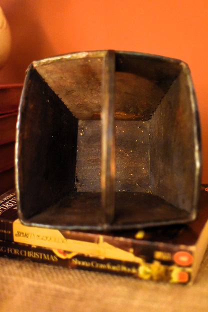 Wooden container on top of a book with a clean interior