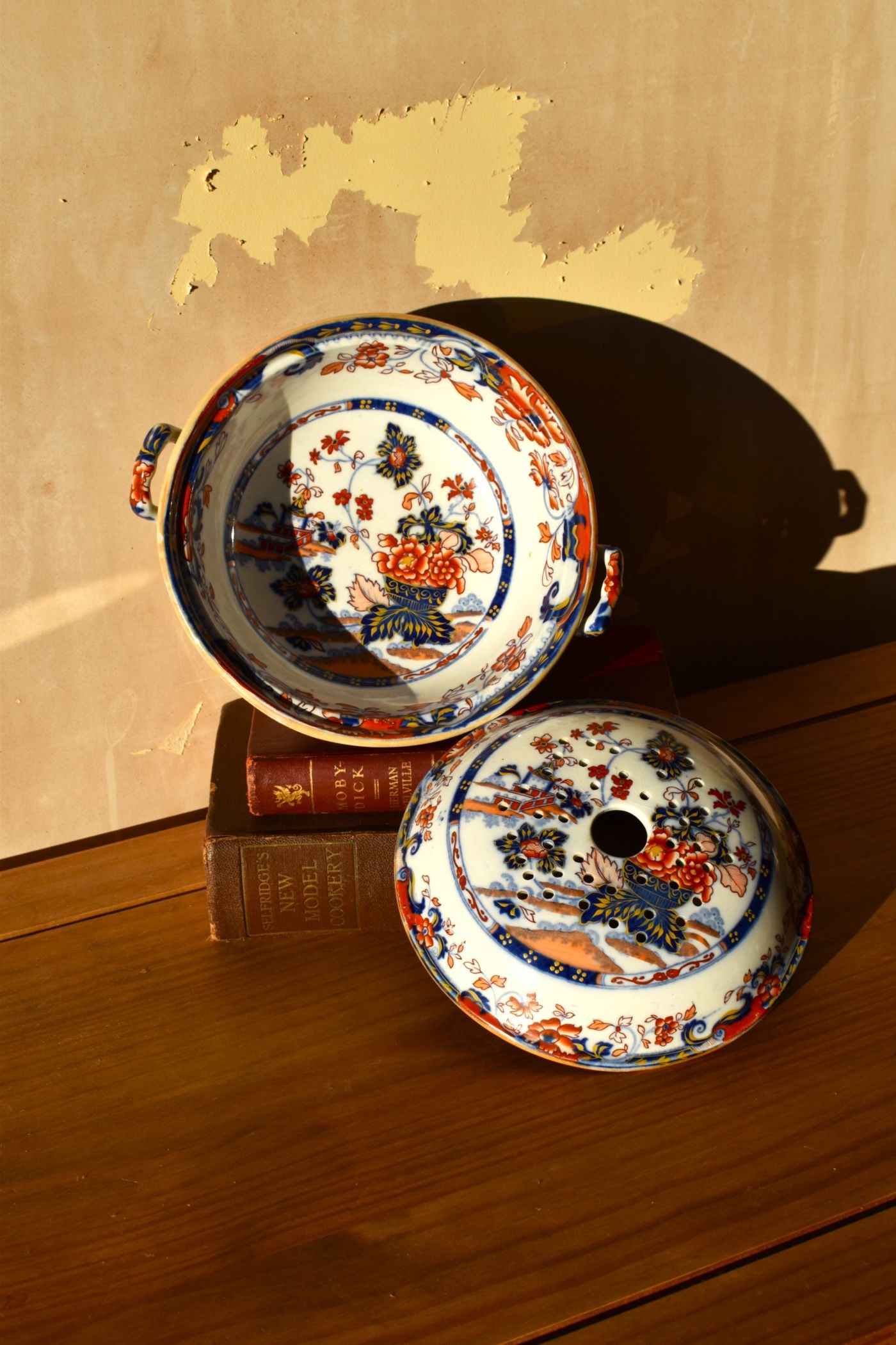 Decorative ceramic plates with intricate designs on a wooden surface.