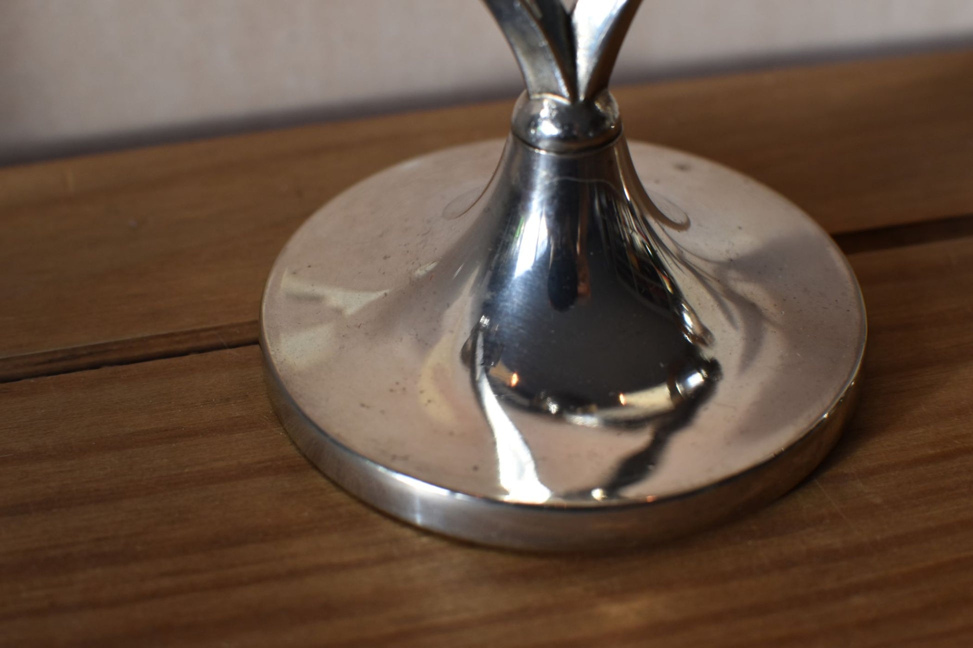 the silver base of the candlestick