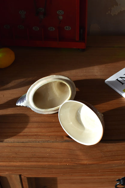 the inside of the covered dish is white and clean