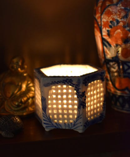 Decorative lantern with lattice design on a dark background