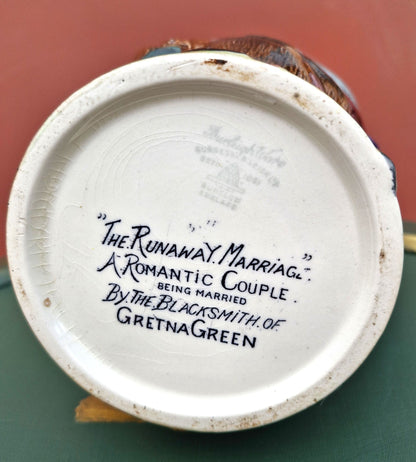 Base of a decorative item with text on a white background