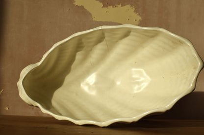 White ceramic bowl on a brown surface
