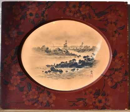 Decorative artwork with a circular landscape scene inside a red frame with floral designs.