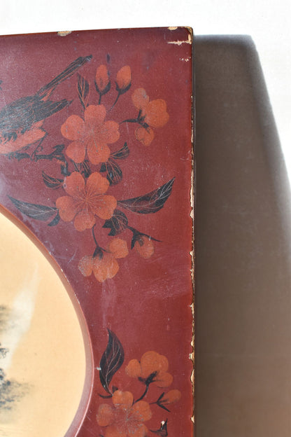 Decorative object with floral patterns on a red background