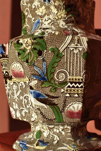 Decorative jug with intricate patterns and colors on a brown background