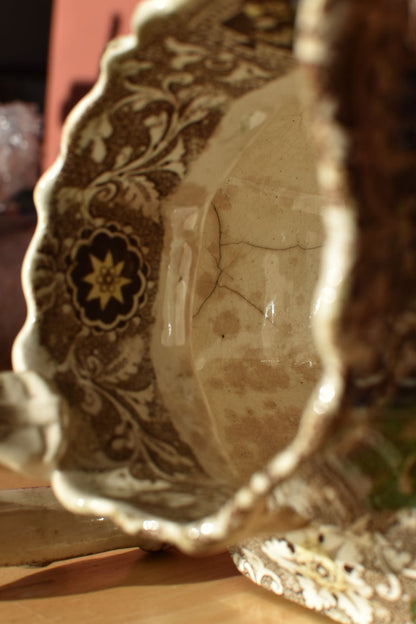 Decorative ceramic bowl with intricate patterns on a wooden surface
