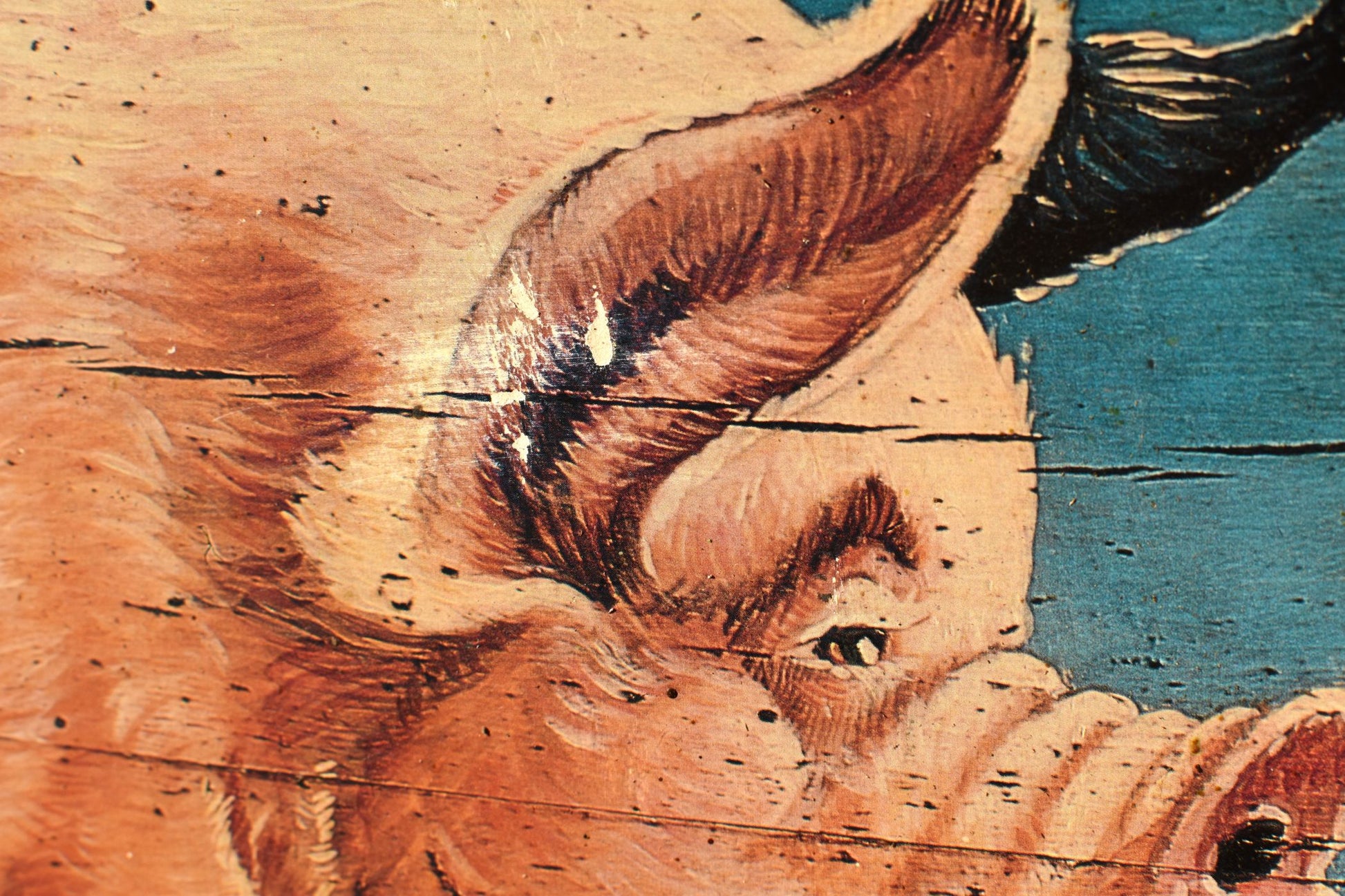 a closeup of the pig's face and ear shows some paint loss