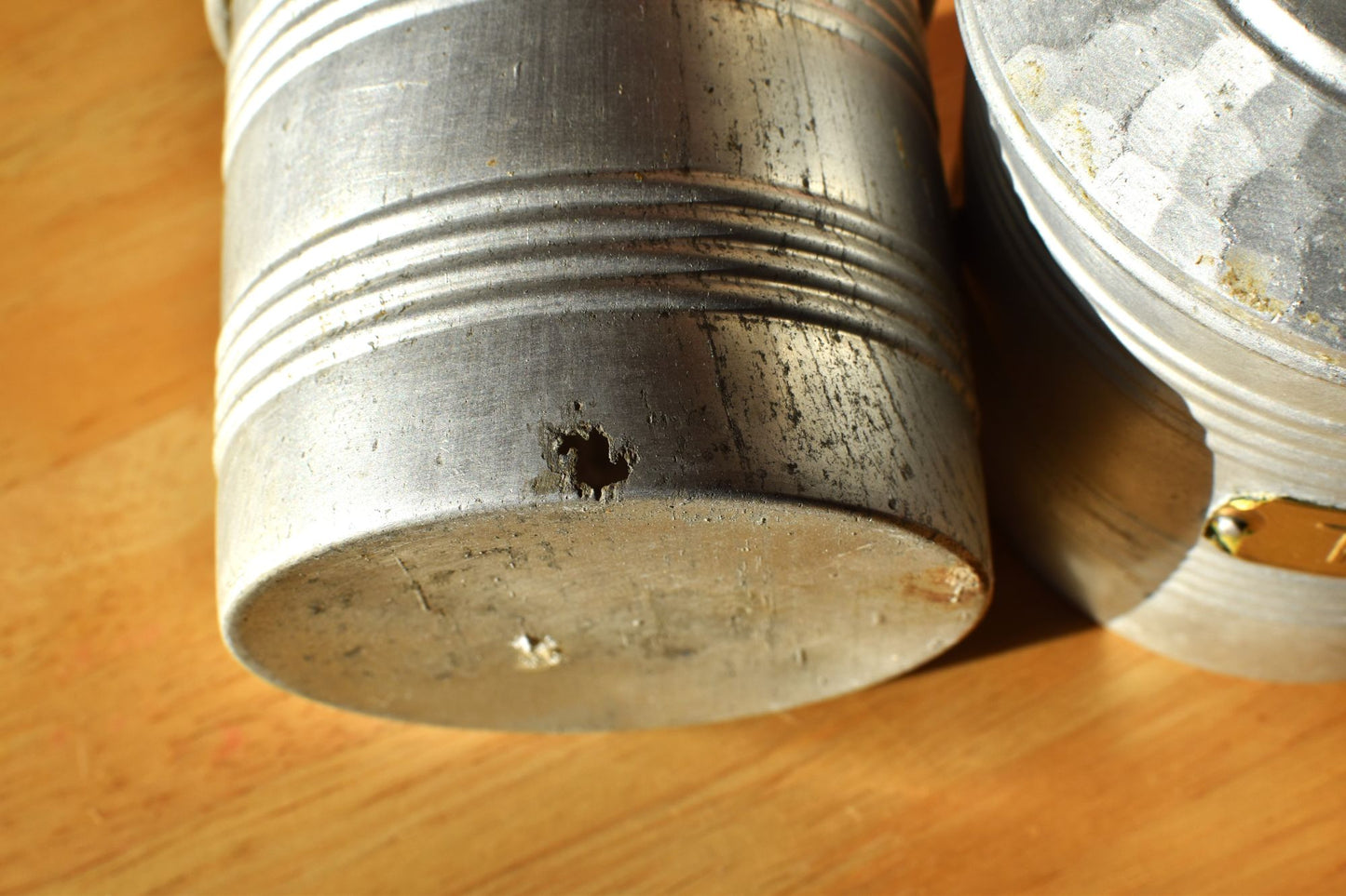 one of the silver tins has a corrosion hole near the base