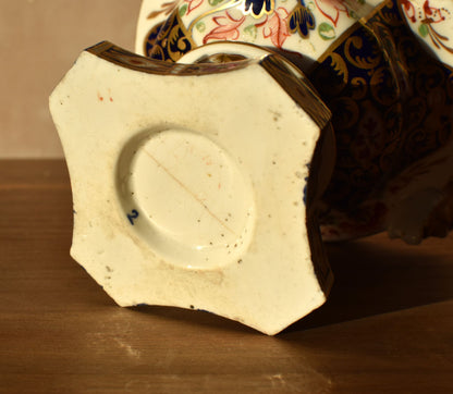 Close-up of a ceramic dish with a decorative rim on a wooden surface